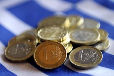 Кредиторы решили списать больше половины долга Греции